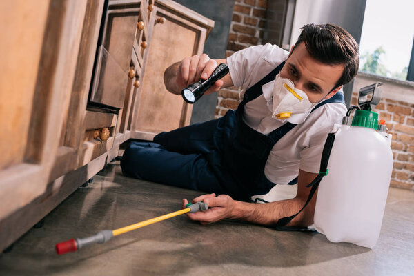 depositphotos_203575006 stock-photo-pest-control-worker-spraying-pesticides